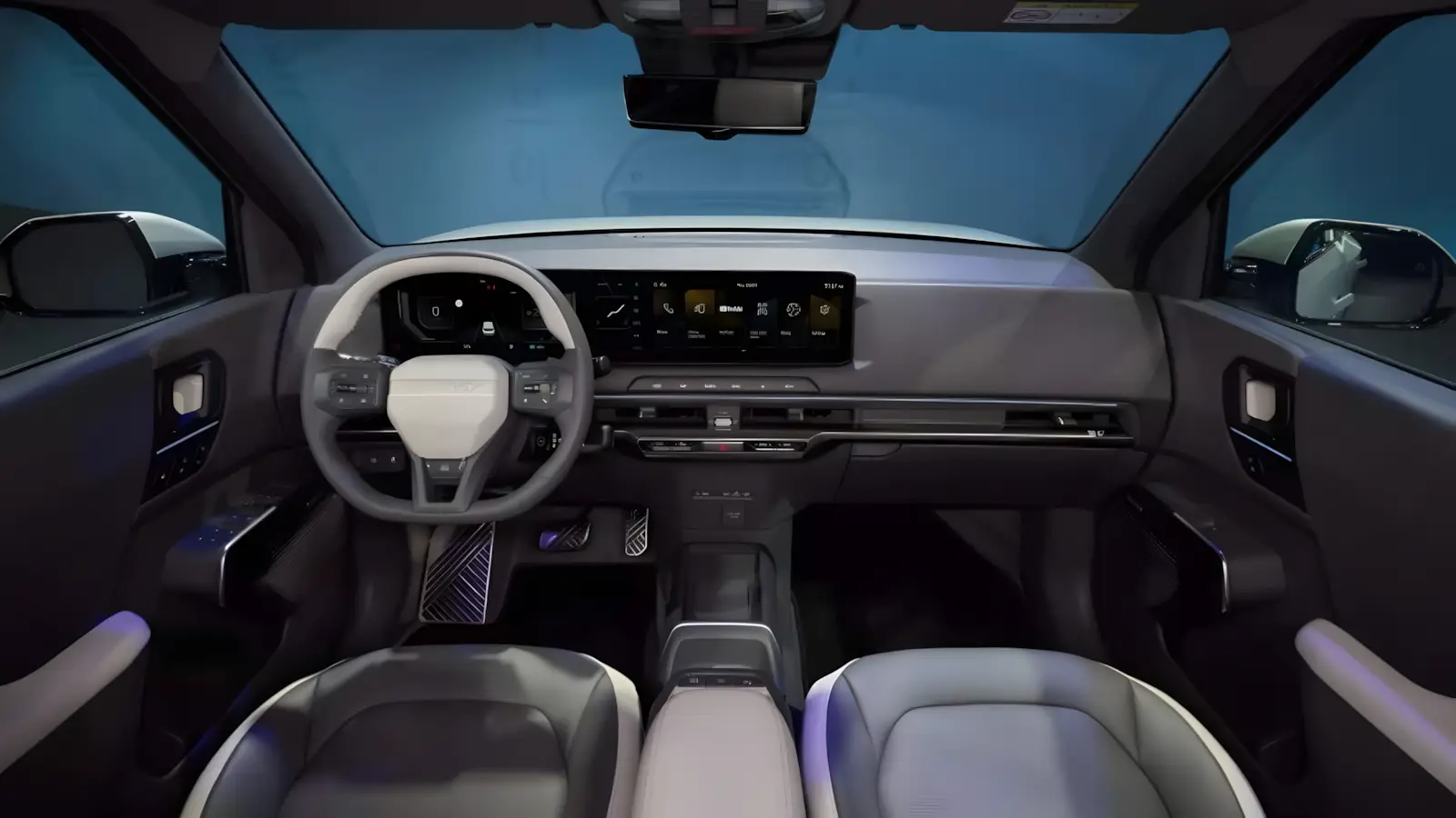 Interior do Kia EV2 com painel de tr&ecirc;s telas digitais e acabamento premium